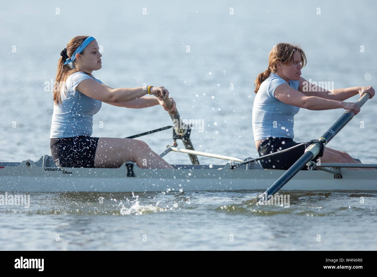 Rowers in a racing shell boat compete in a Johns Hopkins University crew invitational event in Baltimore, Maryland, April 15, 2006. From the Homewood Photography collection. () Stock Photo