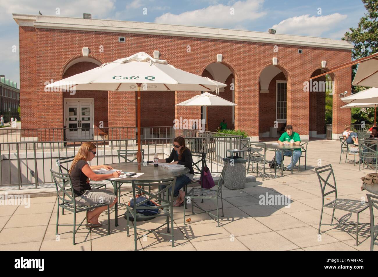 People dine outdoors at Cafe Q at the Milton S Eisenhower Library on the Homewood Campus of the Johns Hopkins University in Baltimore, Maryland, April 25, 2006. From the Homewood Photography collection. () Stock Photo