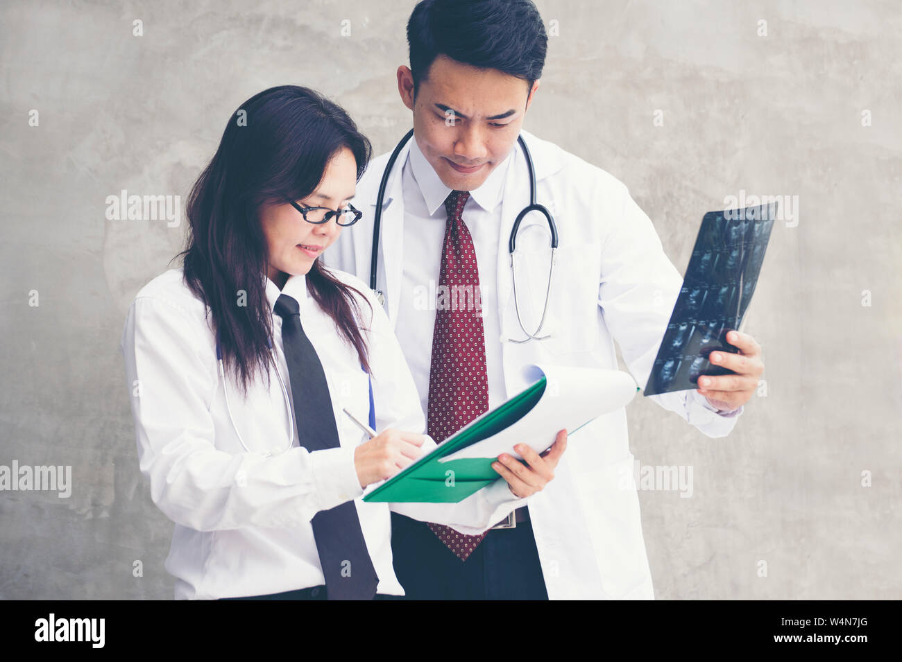healthcare and medical concept. doctors meeting discussing on patient Chart information and X-ray Images. Stock Photo