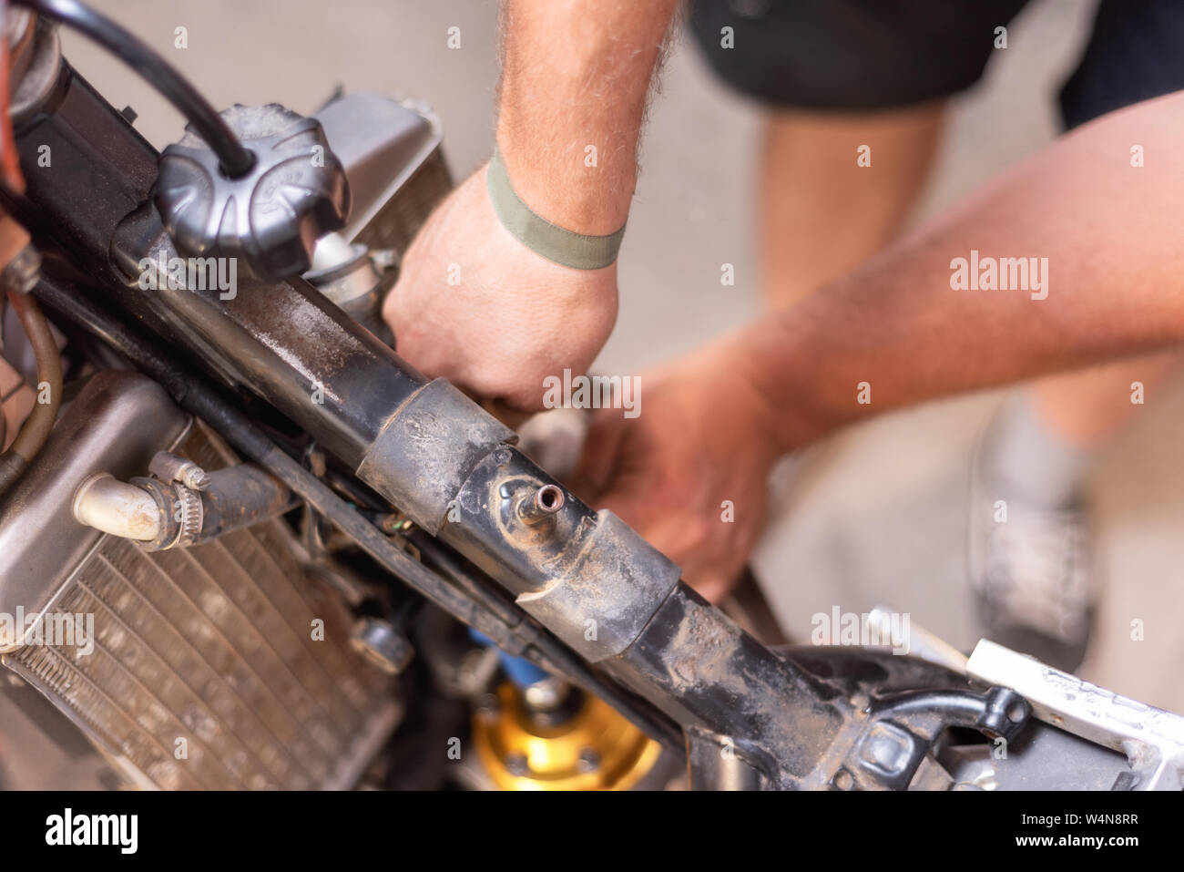 Motorbike mechanic, replacing the cooling radiator. Replacement or ...