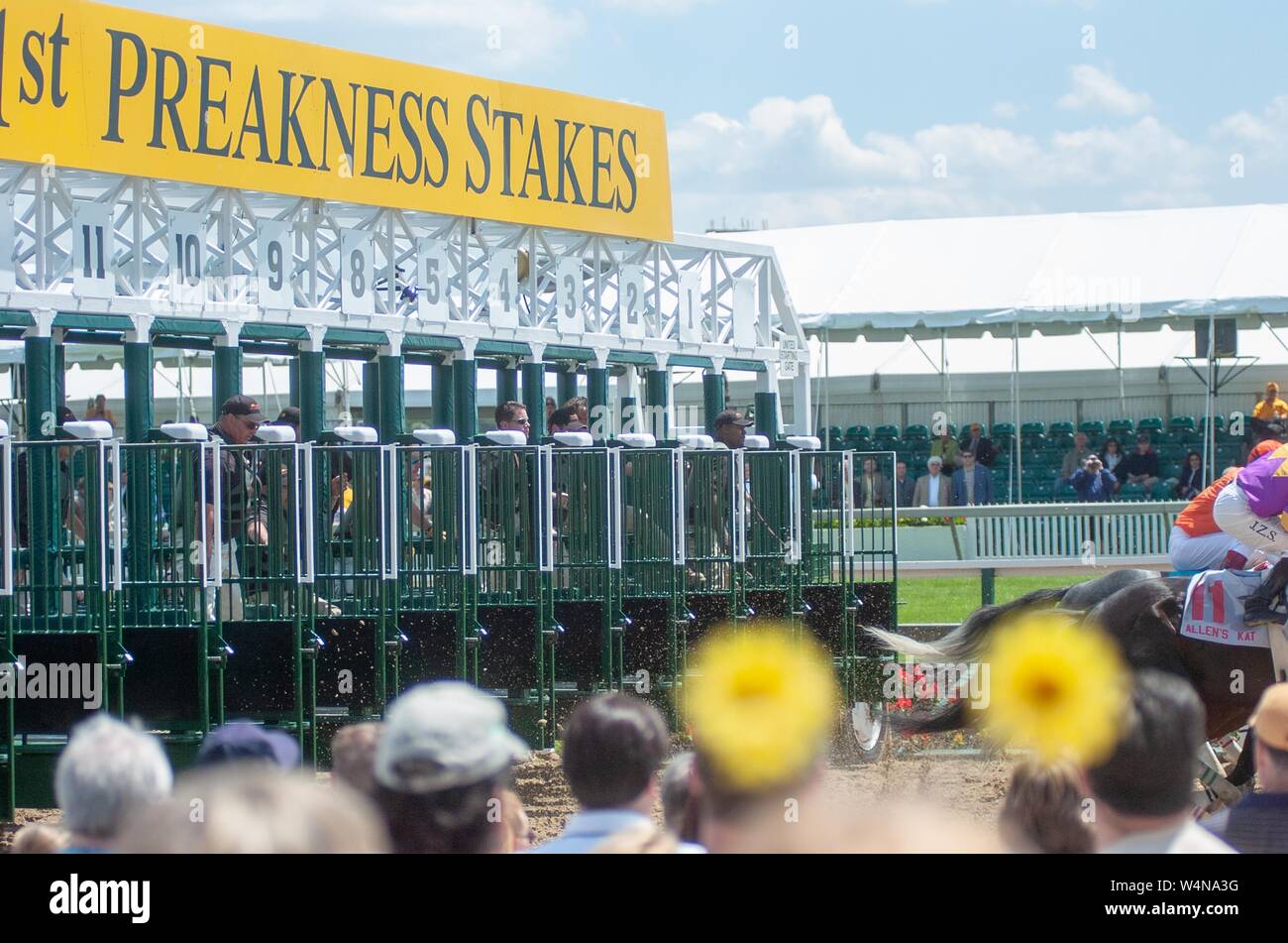 Spectators watch preparations at the gate during the Preakness Stakes, on a sunny day, at the Pimlico Race Course, Baltimore, Maryland, May 20, 2006. From the Homewood Photography Collection. () Stock Photo