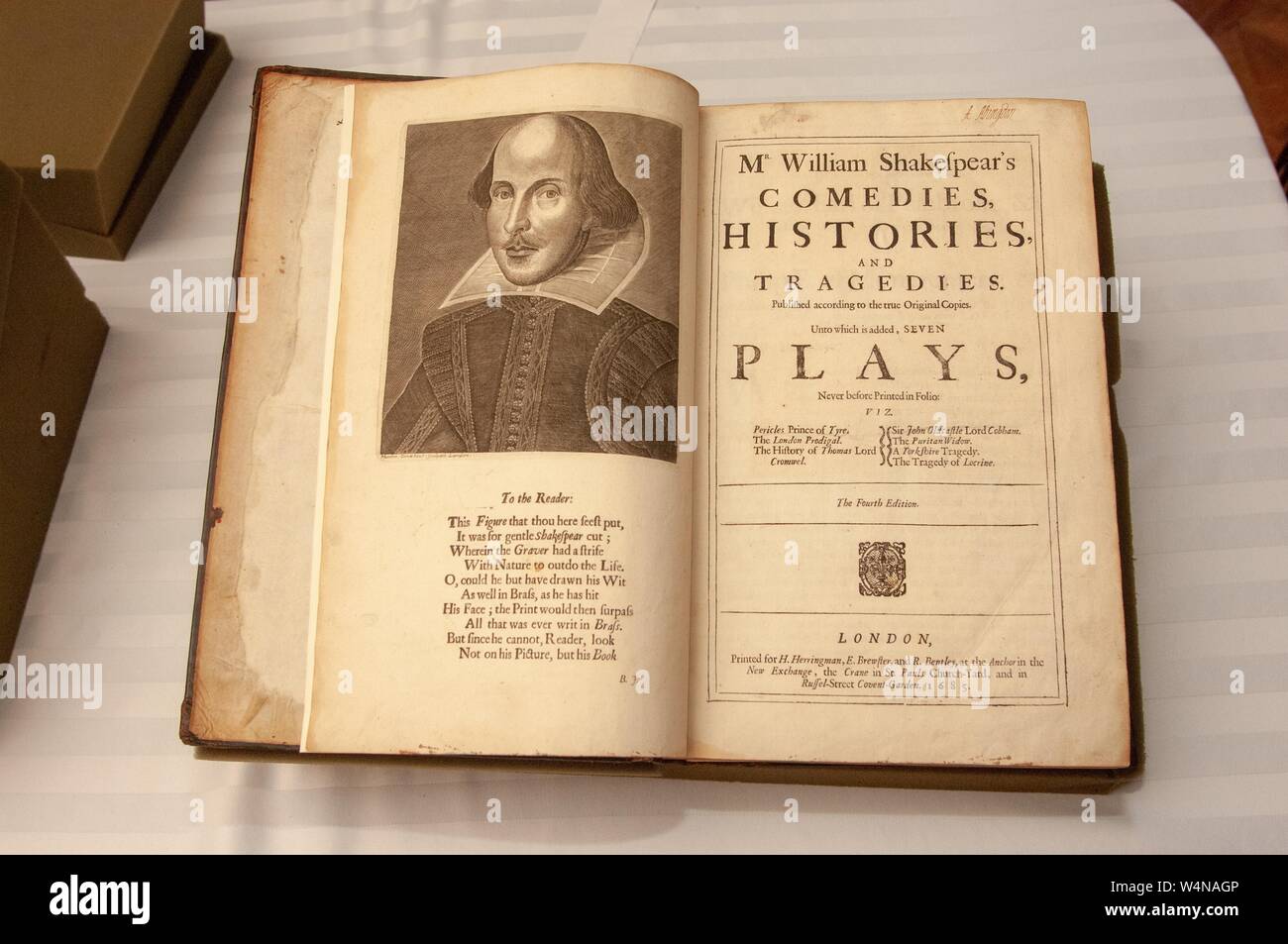 High-angle shot of a 1685 copy of Shakespeare's plays, open to the title page with a picture of the playwright, from the Milton S Eisenhower Library's collection, at the Johns Hopkins University, Baltimore, Maryland, July 23, 2006. From the Homewood Photography Collection. () Stock Photo
