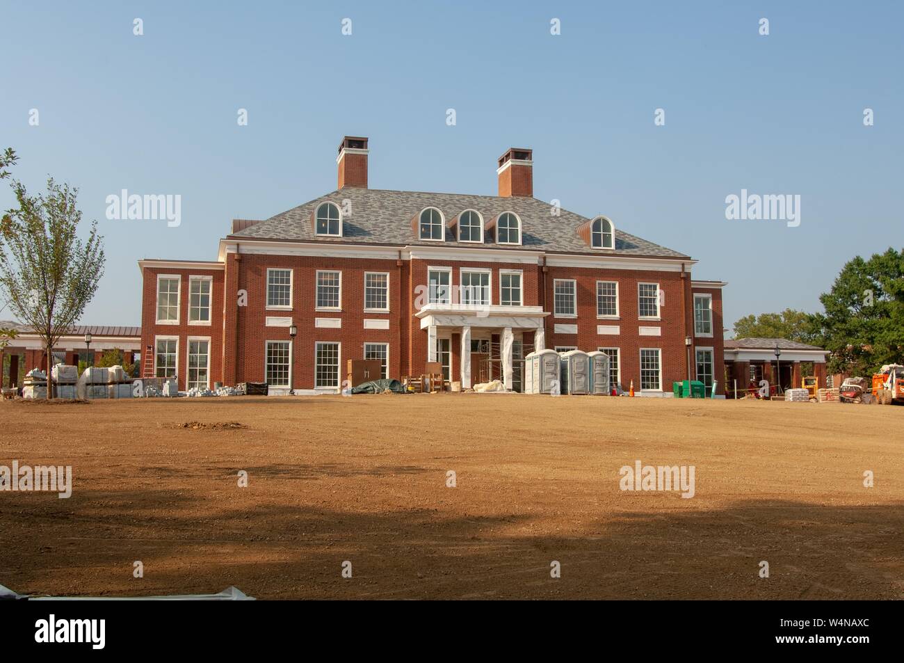Low angle view, on a sunny day, of a dry lawn and construction supplies in front of Mason Hall, an admissions building and visitor center at the Johns Hopkins University, Baltimore, Maryland, August 24, 2007. From the Homewood Photography Collection. () Stock Photo