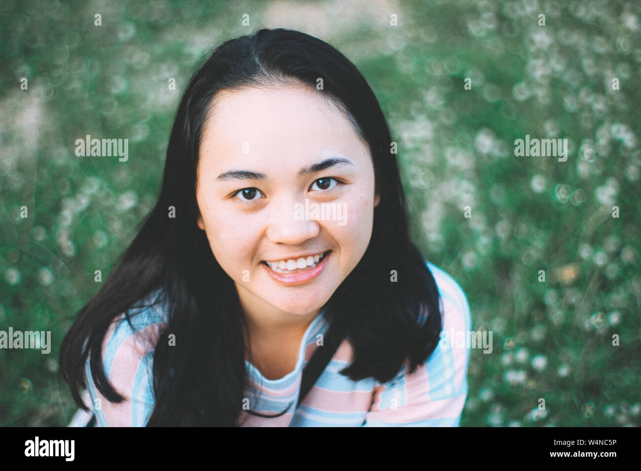 Asian Girl Teen Smile On Flower Field Vintage Retro Film Grain Noise