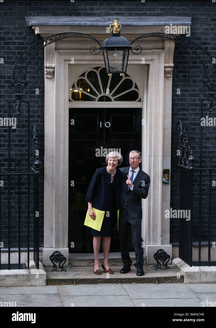London, UK. 13th July, 2016. File photo taken on July 13, 2016 shows British Prime Minister Theresa May (L) and her husband posing for photos in front of 10 Downing Street in London, Britain. Newly-elected Conservative Party leader Boris Johnson took office as the British prime minister on Wednesday amid the rising uncertainties of Brexit. The latest development came after Theresa May formally stepped down as the leader of the country and Johnson was invited by the Queen to form the government. Credit: Han Yan/Xinhua/Alamy Live News Stock Photo
