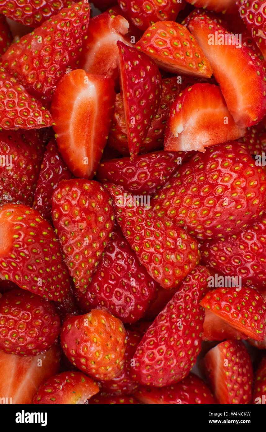Cut strawberries close view Stock Photo - Alamy