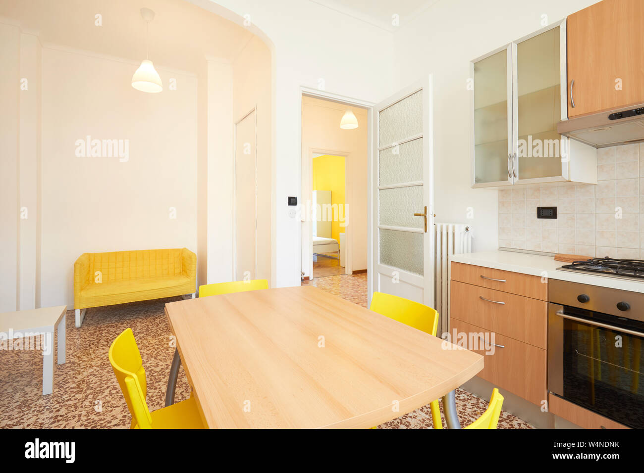 White kitchen interior in renovated, spacious apartment for rent Stock Photo
