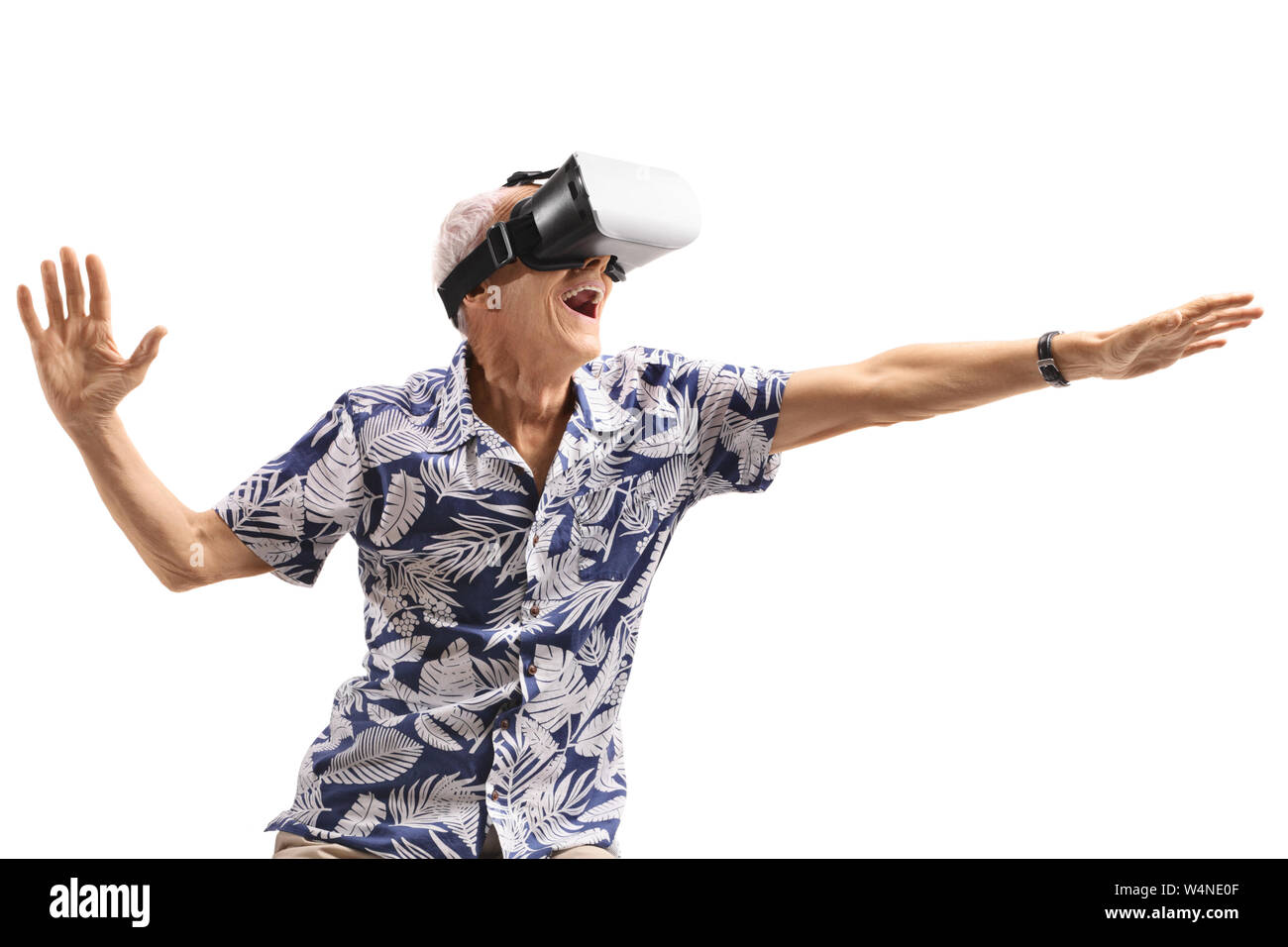 Excited senior man using a VR headset isolated on white background Stock Photo