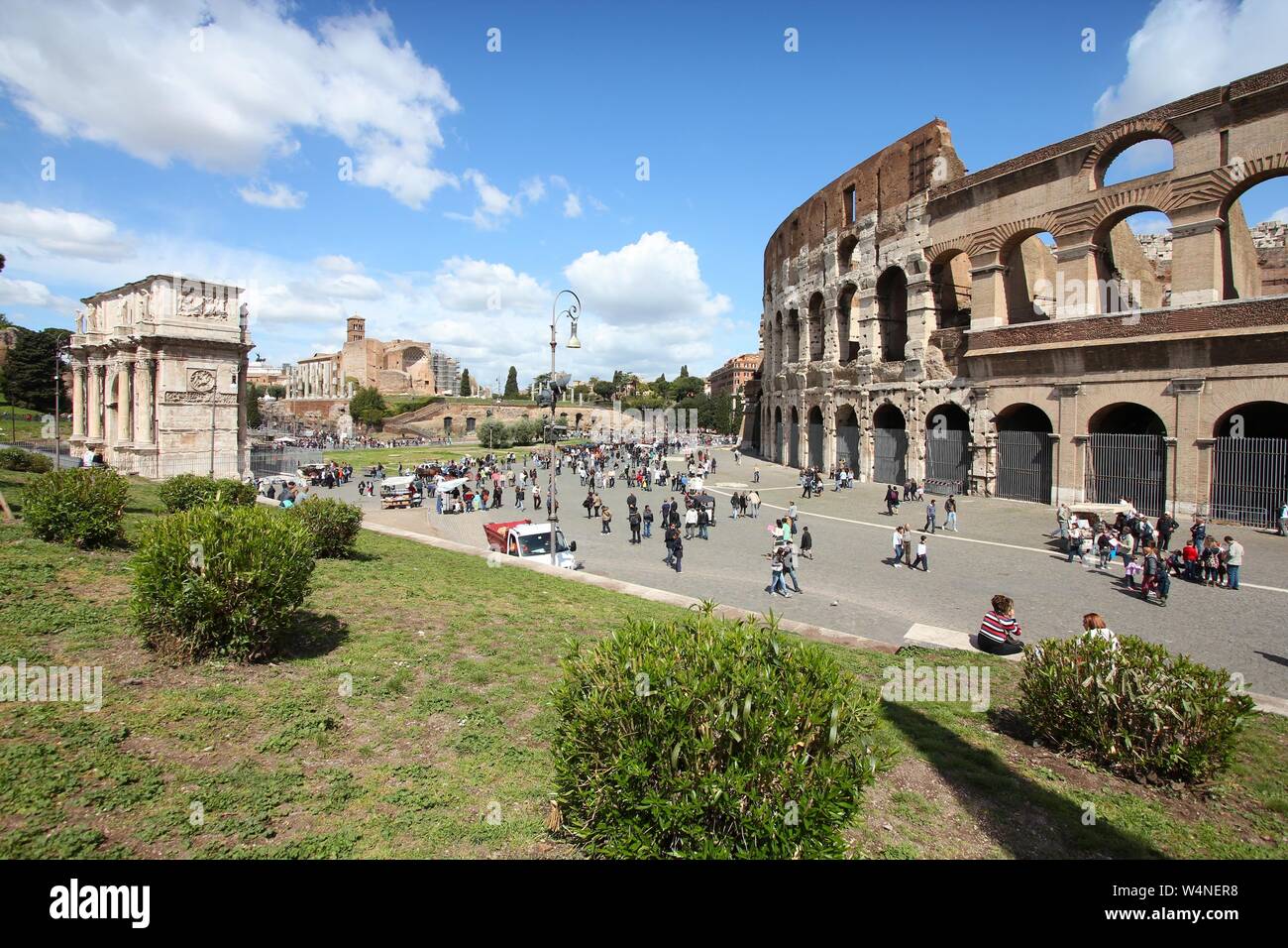 ROME, ITALY - APRIL 8, 2012: People visit Colosseum in Rome. According to Euromonitor, Rome is the 3rd most visited city in Europe (5.5m international Stock Photo