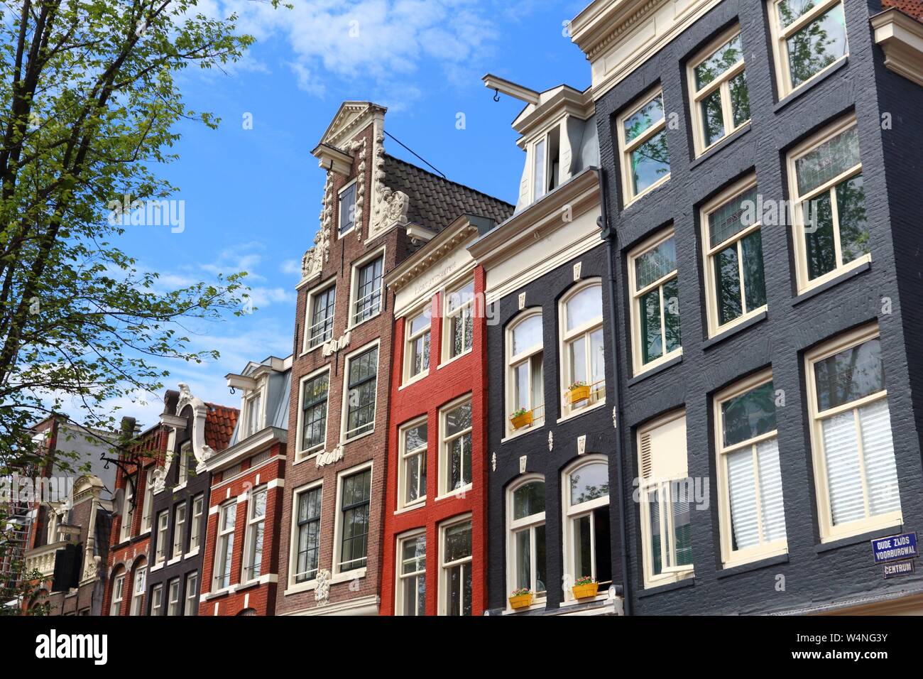 Amsterdam city architecture - Oudezijds Voorburgwal street residential buildings. Netherlands rowhouse. Stock Photo