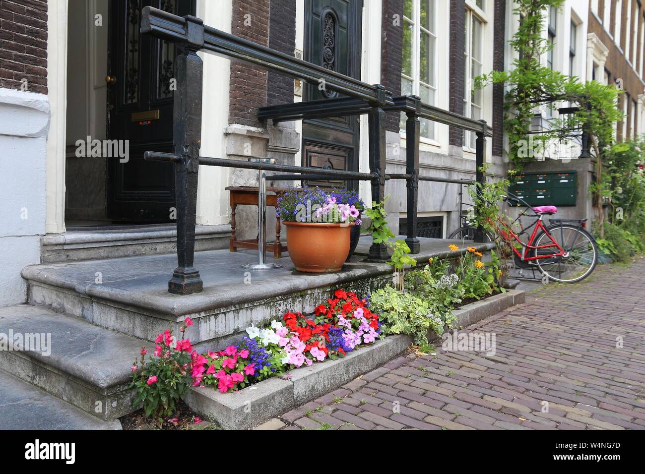 Amsterdam residential street - Keizersgracht canal buildings. Netherlands rowhouse. Stock Photo