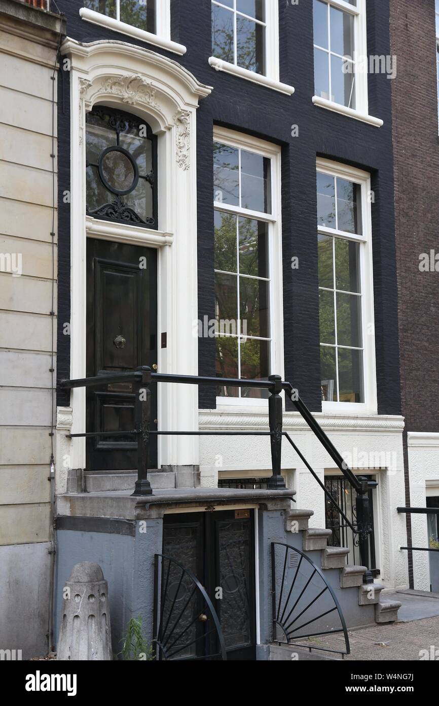 Amsterdam residential street - Keizersgracht canal buildings. Netherlands rowhouse. Stock Photo