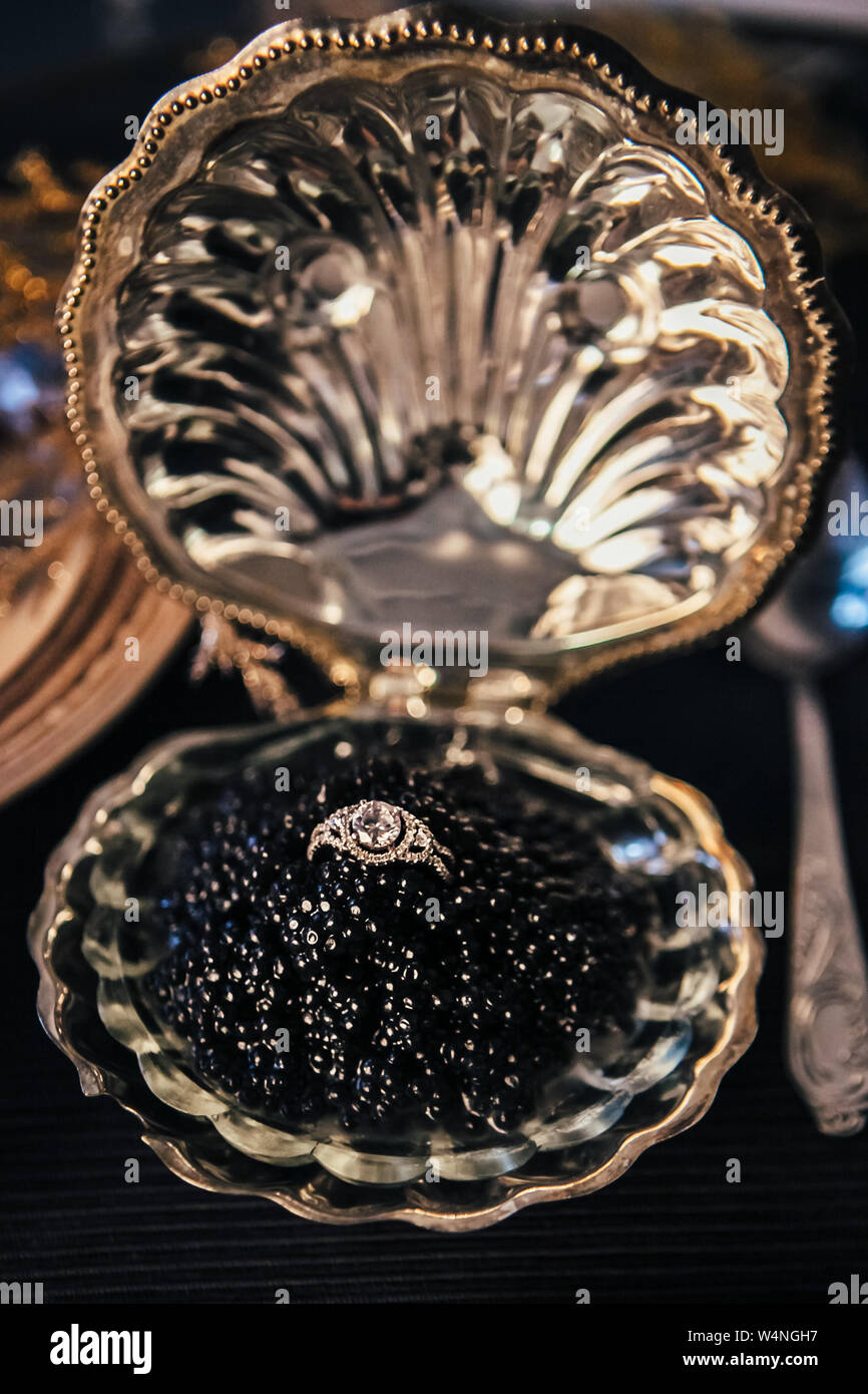 Closeup Engagement Ring With A Huge Diamond In A Bowl With Black