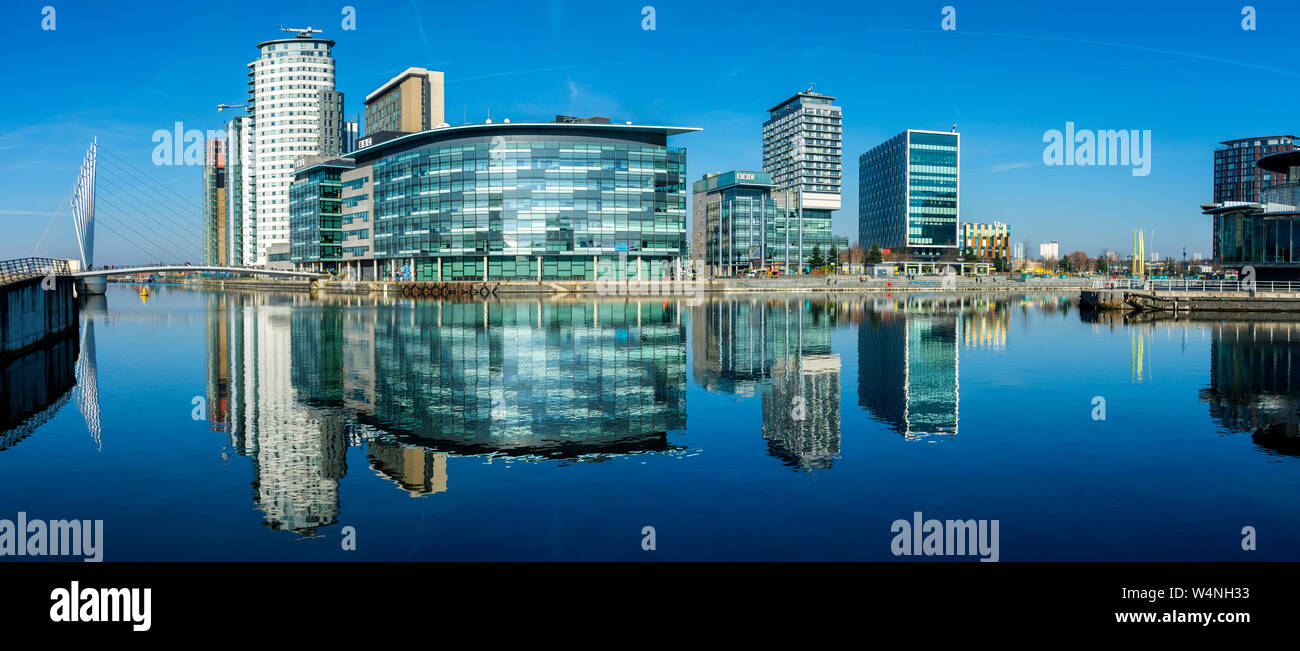 The MediaCityUK complex over the Manchester Ship Canal at Salford Quays, Manchester, England, UK Stock Photo