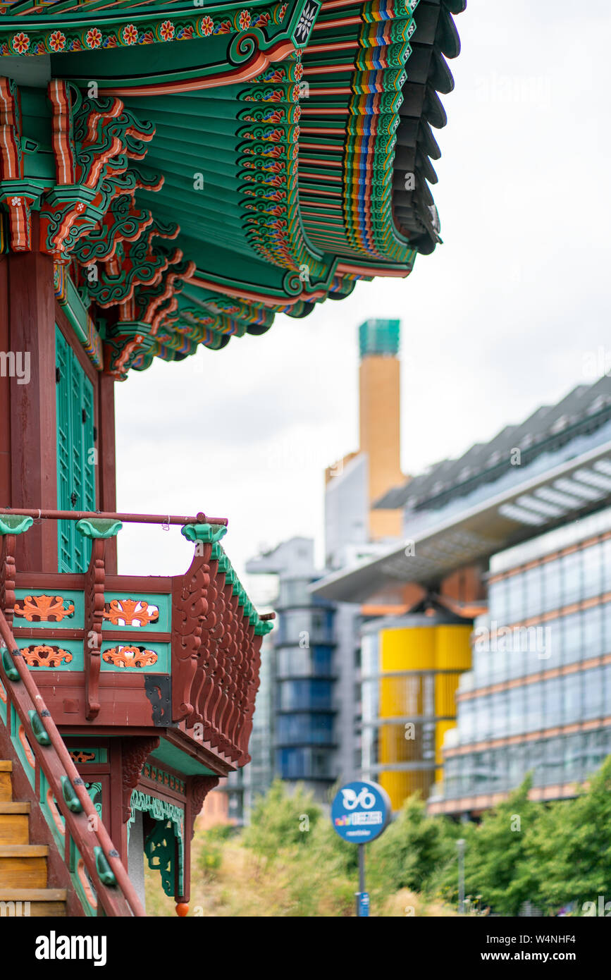 Potsdamer Platz, Berlin, Germany - july 07, 2019:  detail of the korean 'Pavillon der Einheit' in the foreground with modern buildings of the Potsdame Stock Photo