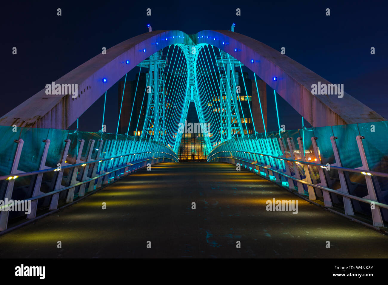 The Millennium (Lowry) footbridge at night.  Over the Manchester Ship Canal, Salford Quays, Manchester, England, UK Stock Photo