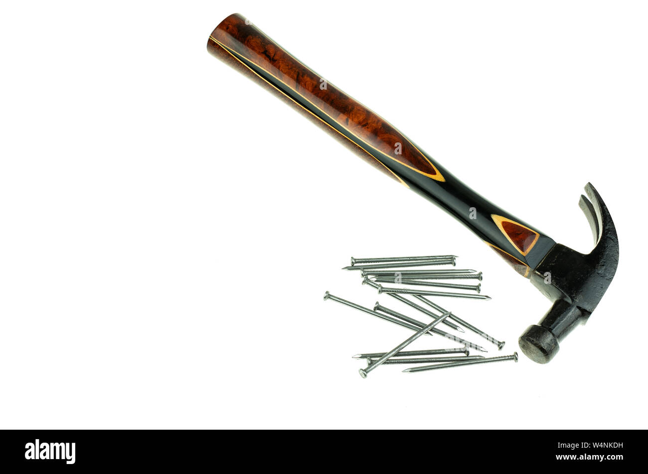 Old traditional curved claw hammer and nail on white background Stock