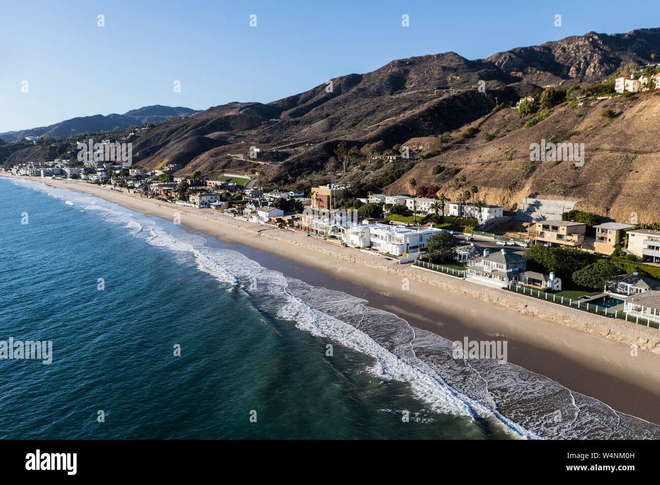 Aerial view of upscale beach homes and the Santa Monica Mountains near Los Angeles in scenic Malibu, California. Stock Photo