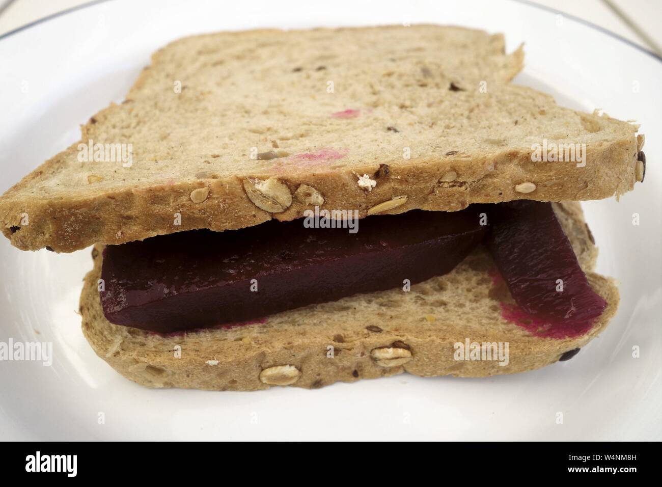 Beetroot Sandwich on Brown Sliced Bread Stock Photo
