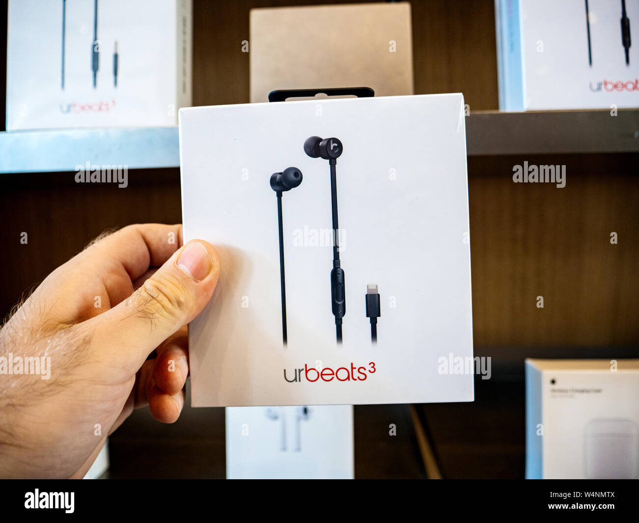 Paris, France - Jul 24, 2019: Man POV personal perspective inside Apple Store at the new Apple URBeats 3 shopping for new headphones Stock Photo