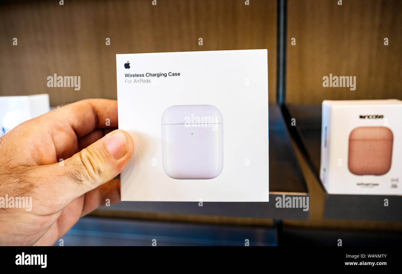 Paris, France - Jul 24, 2019: Man POV personal perspective inside Apple Store at the new Wireless charging case for AirPods Stock Photo