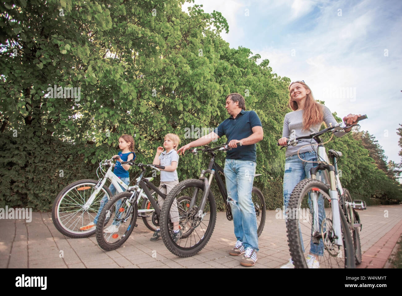 The family in the park in the bicycles Stock Photo - Alamy