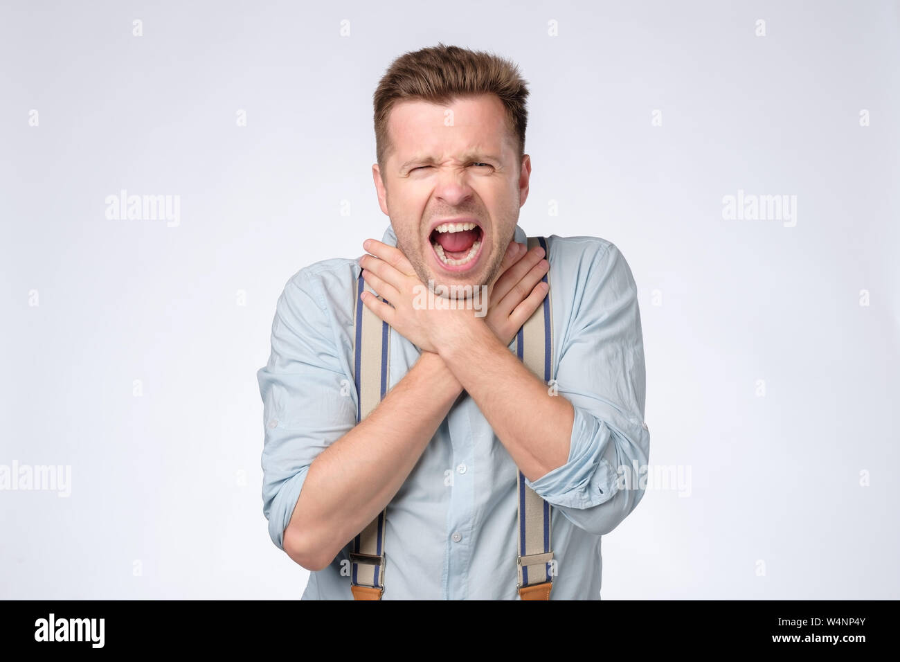 Young man strangling himself hi-res stock photography and images - Alamy