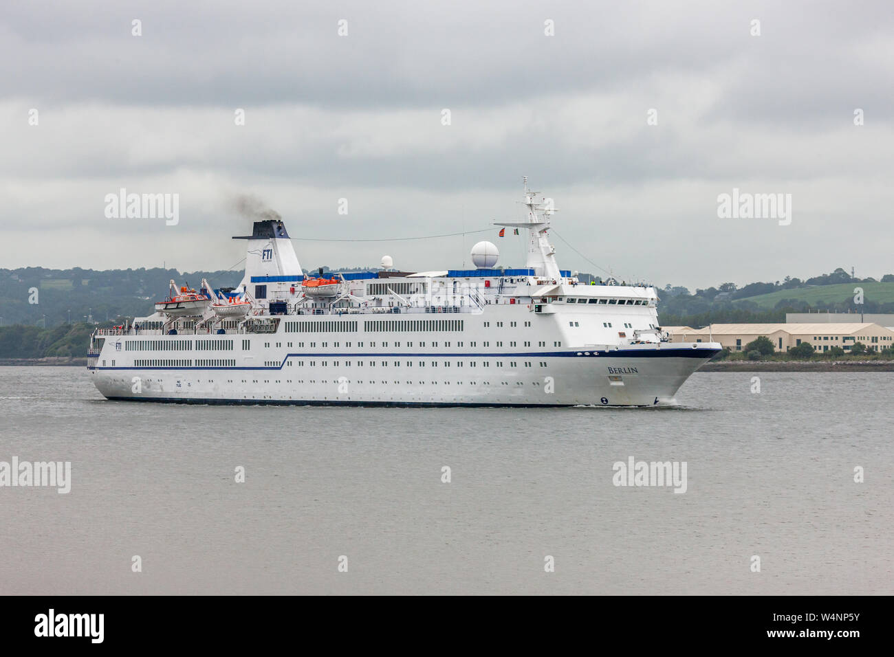 Passage West, Cork, Ireland. 24nd July, 2019. Cruise ship Berlin steams down the River Lee near the picturesque village of Passage West, Co. Cork, after spending the day in Cork City, Ireland. Credit;  David Creedon / Alamy Live News Stock Photo