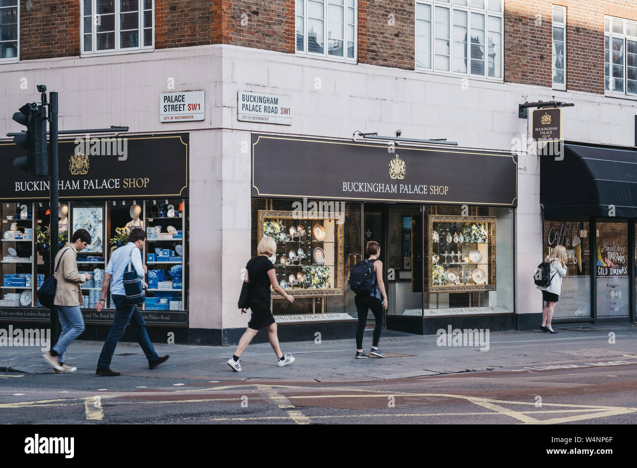 London, UK - July 15, 2019: Tourists walking past Buckingham Palace Shop, London, a Royal shop for gifts, collections and commemorative souvenirs comm Stock Photo
