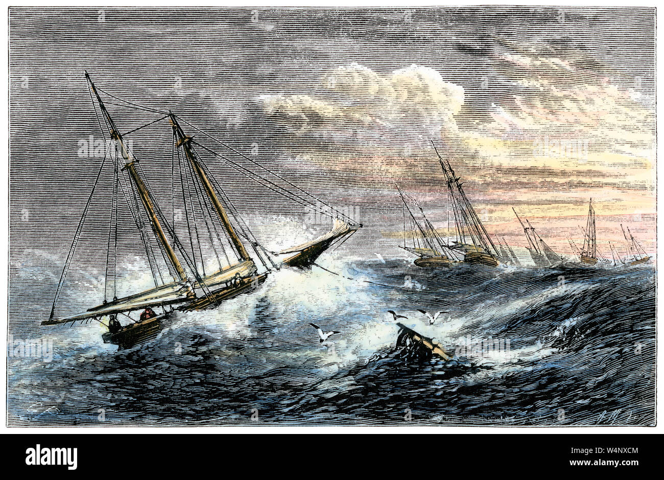 Fishing boats riding out a gale on the Grand Banks, 1800s. Hand-colored woodcut Stock Photo