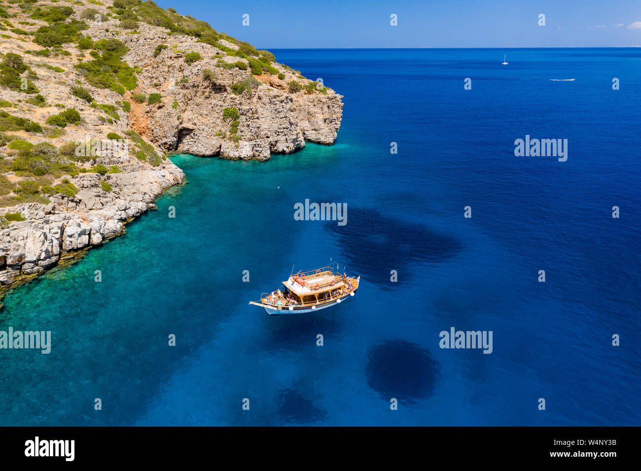 Aerial drone view of traditional Greek wooden boats floating on the