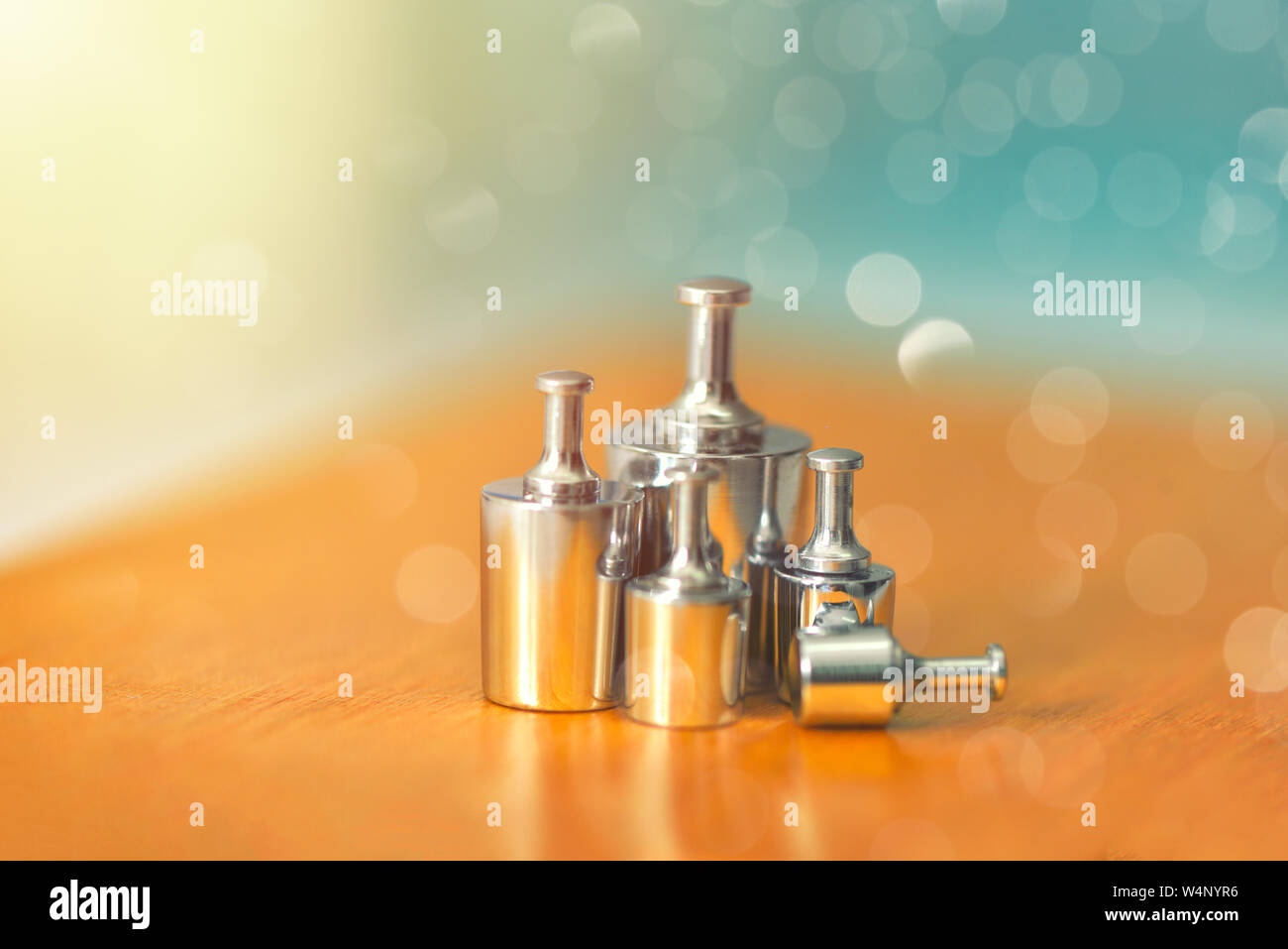 Set of metal weights for scales and the calibration test. Weight set for calibration balance to accuracy and precision. Apothecary, pharmacist, scient Stock Photo