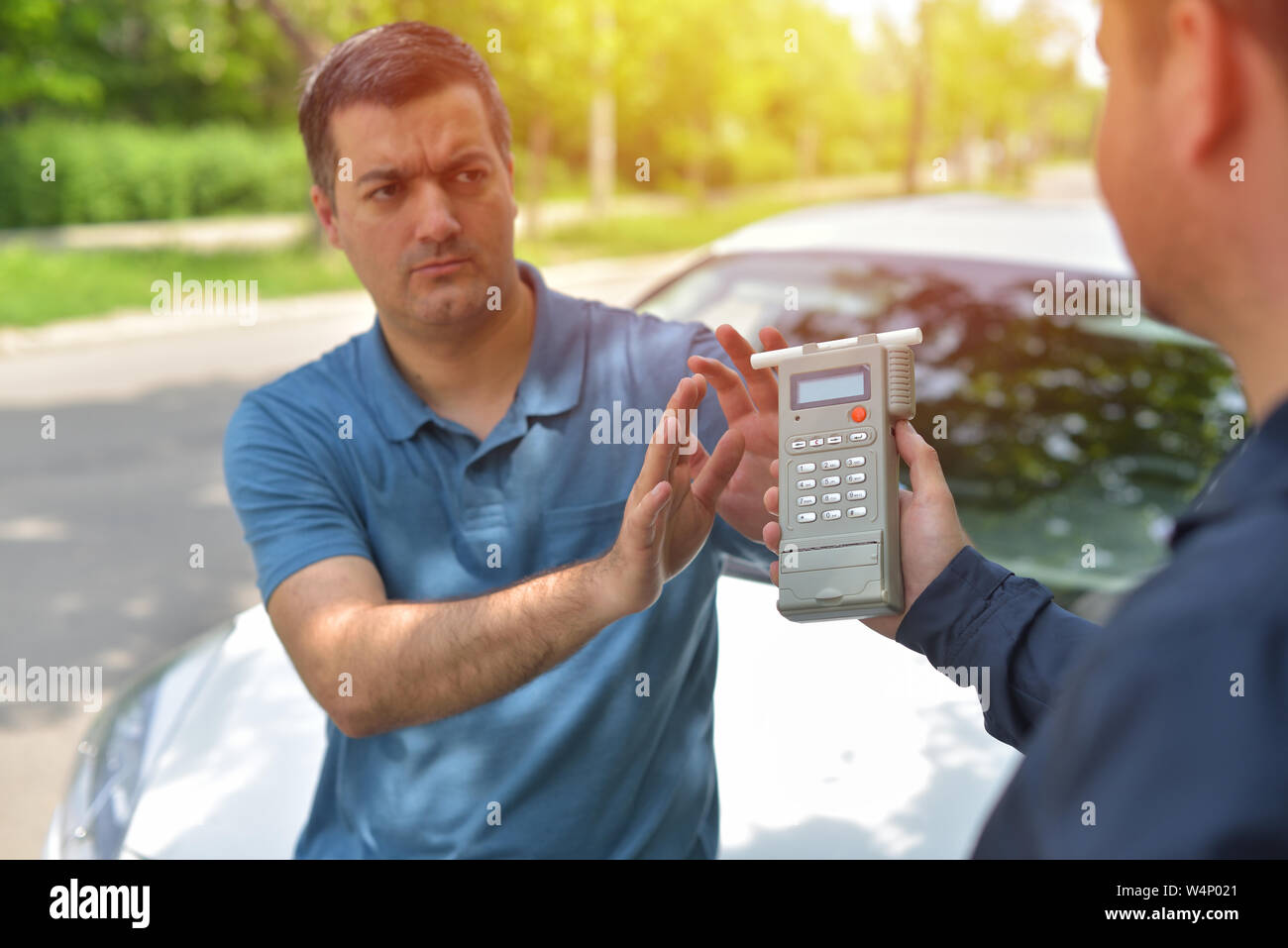 Driver due to being subject to test for alcohol content with use of breathalyzer Stock Photo