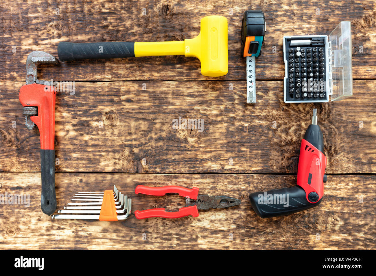 Old hand tools, pliers, hammer, tape measure, adjustable wrench