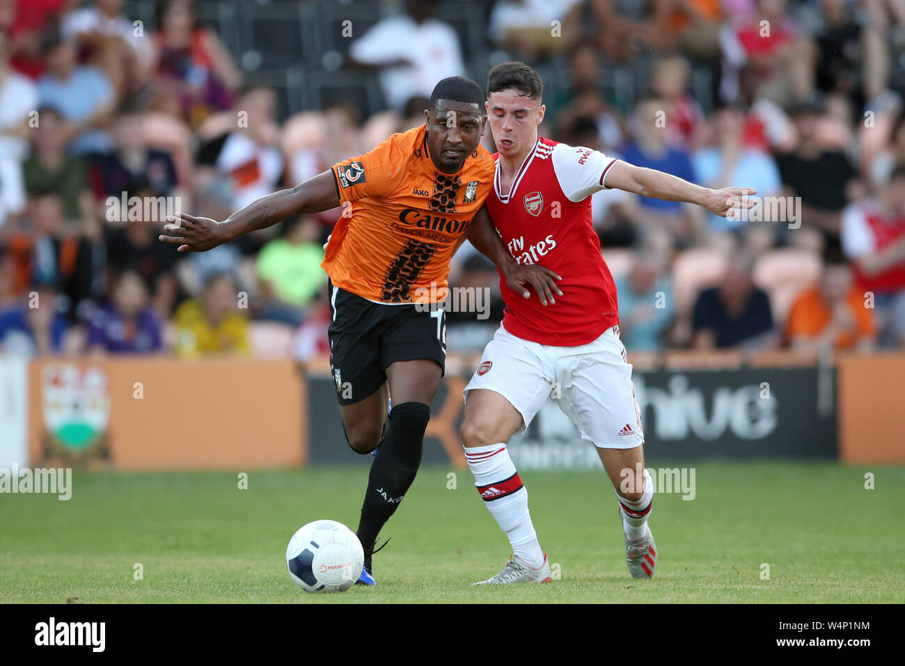 Barnet's Andre Boucaud (left) and Arsenal's Harrison Clarke battle for the ball during the pre-season friendly match at The Hive, London. Stock Photo