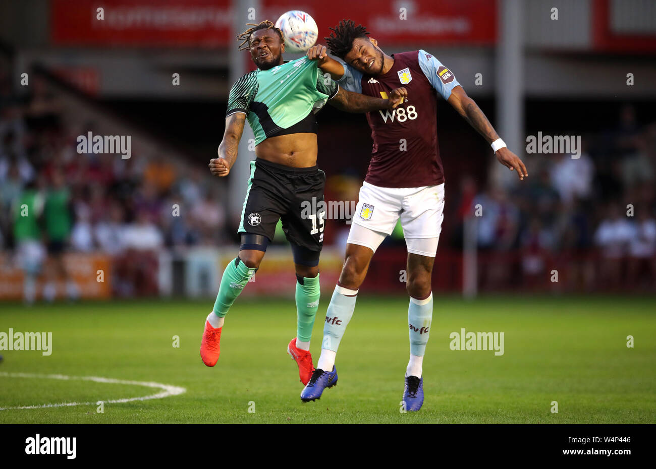 Walsall's Morgan Ferrier (left) and Aston Villa's Tyrone Mings battle for the ball during the pre-season friendly match at the Banks's Stadium, Walsall. Stock Photo
