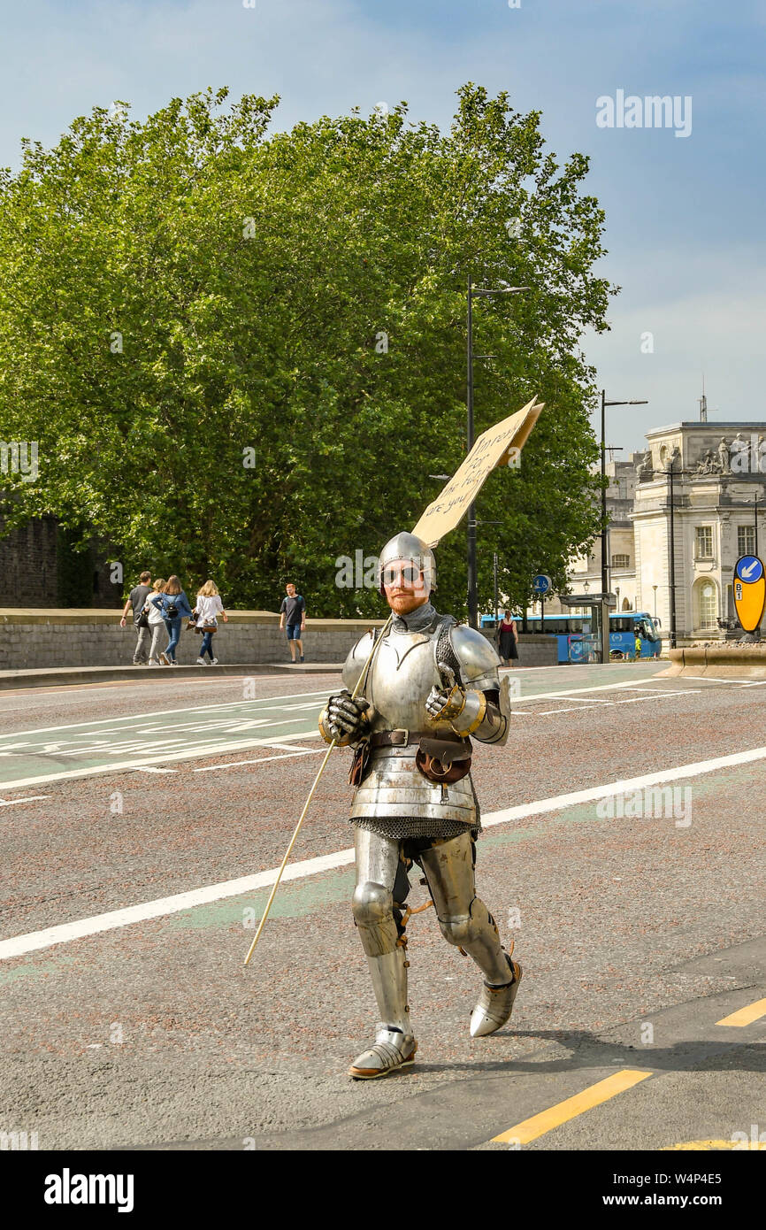 CARDIFF, WALES - JULY 2019: Protester dressed as a knight in shining armour at the Climate Emergency protest by Extinction Rebellion in Cardiff Stock Photo