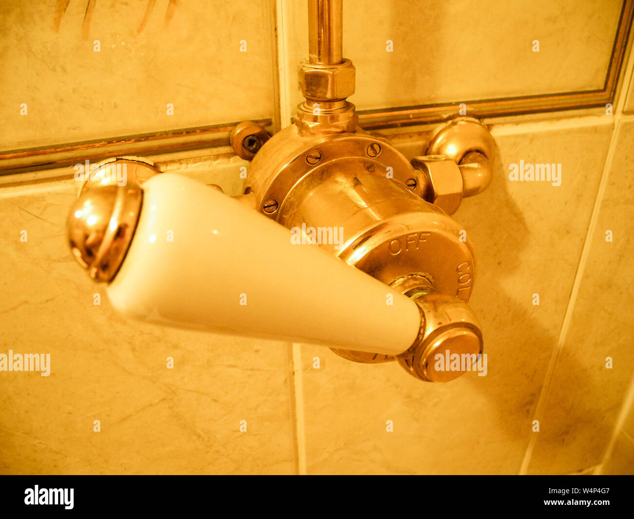 Golden shower handle in a bathroom in England, UK Stock Photo Alamy