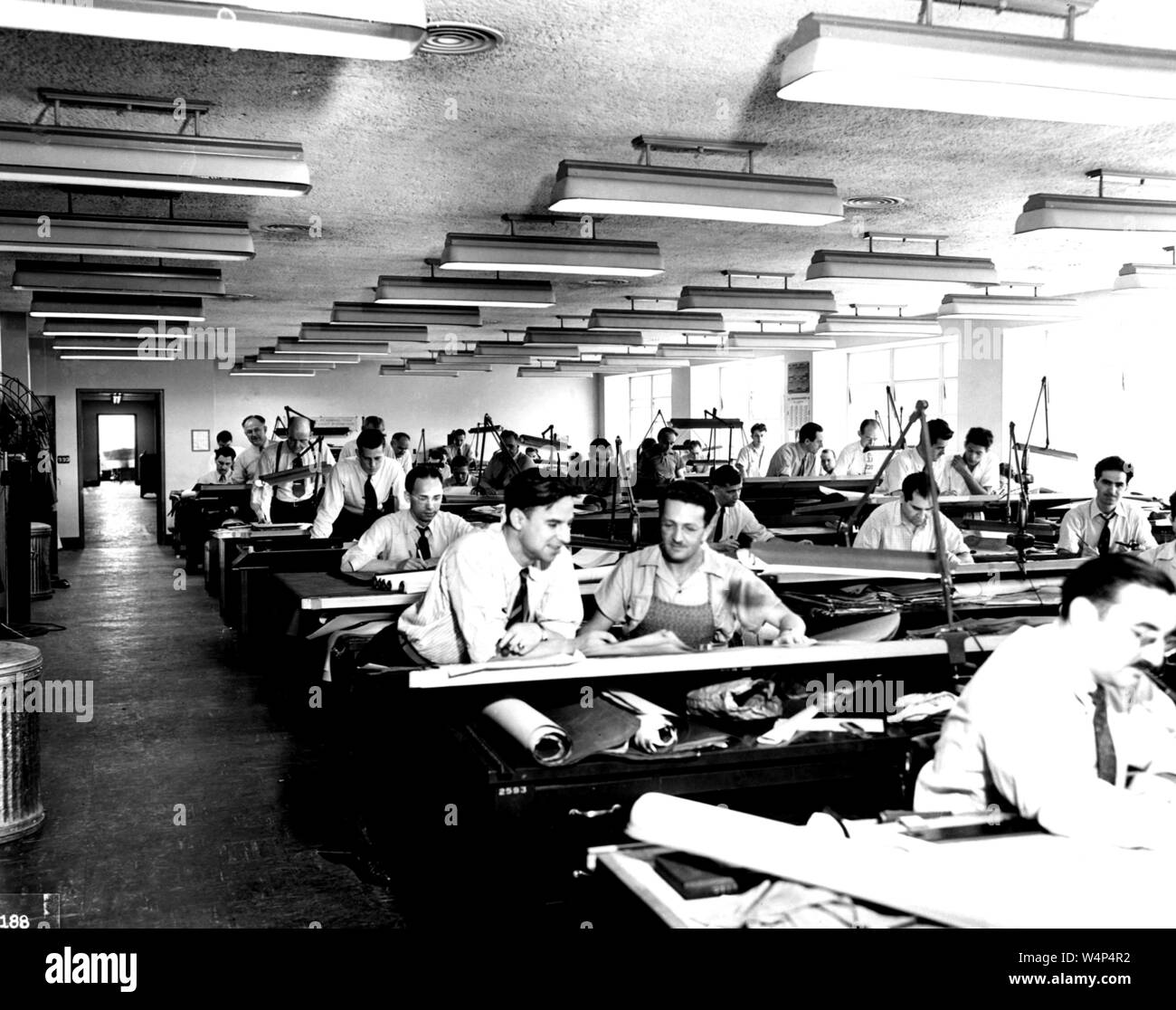 Men work in the Drafting Room, Aircraft Engine Research Laboratory, John H. Glenn Research Center, Cleveland, Ohio, September 21, 1942. Image courtesy National Aeronautics and Space Administration (NASA). () Stock Photo