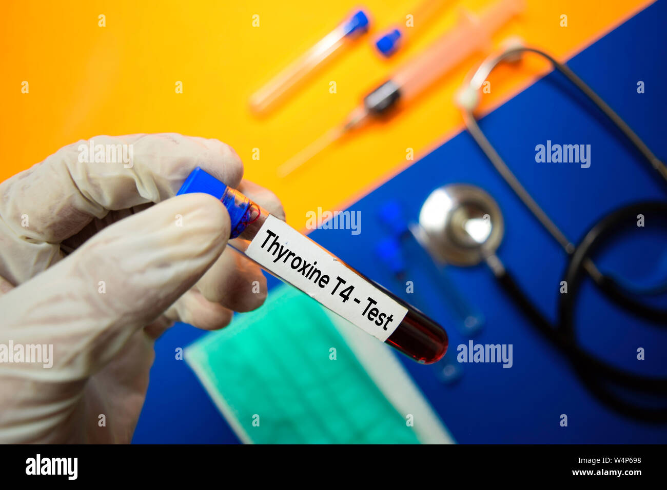 Thyroxine T4 Test with blood sample. Top view isolated on color