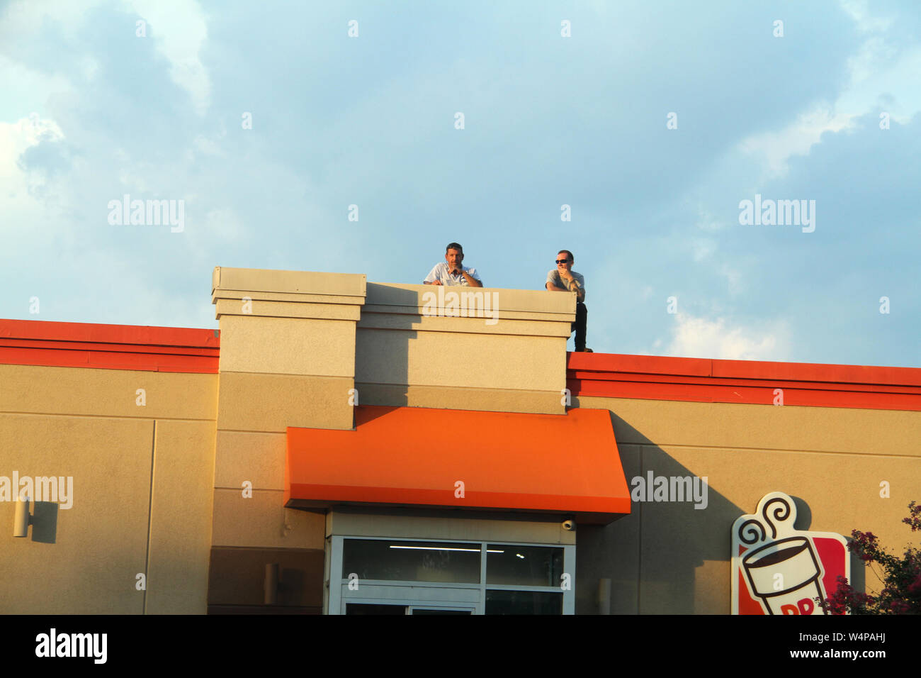 Men on top of a building in the U.S.A. Stock Photo