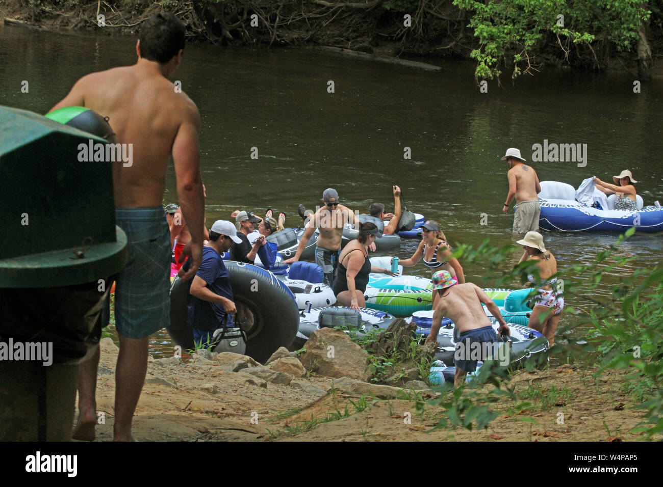 People tubing on Neuse River in North Carolina, USA Stock Photo