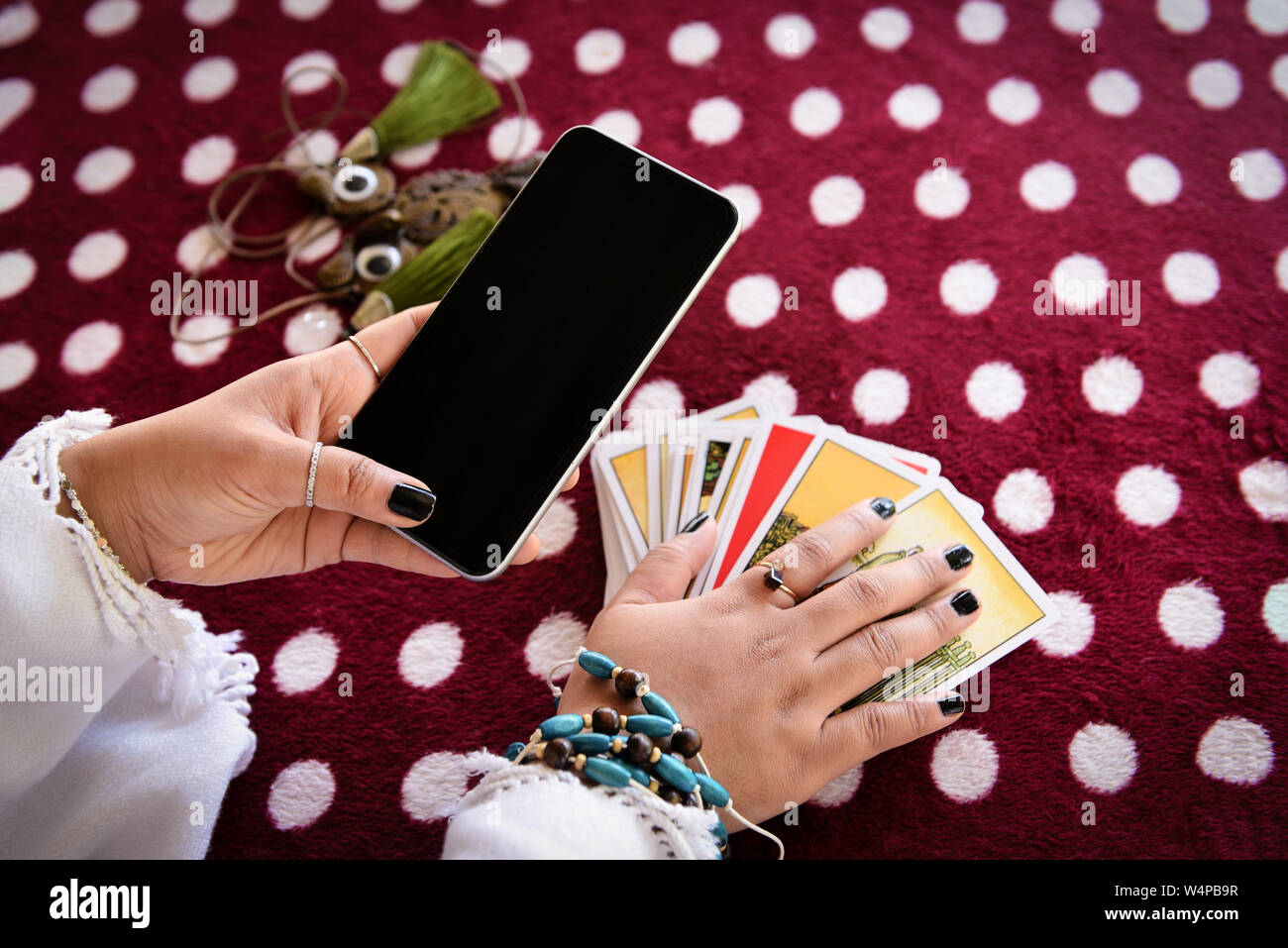 Fortune teller reading fortune lines on screen smartphone modern