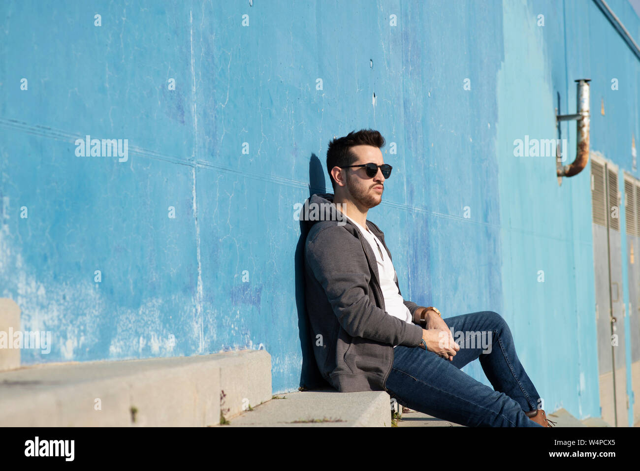 Man sitting stairs side view hi-res stock photography and images - Alamy