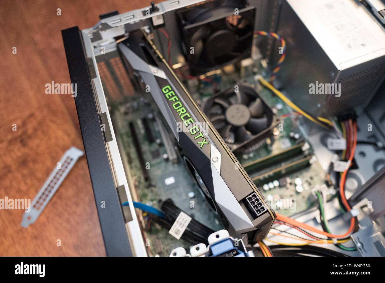 New Nvidia 1070 GTX Graphical Processing Unit (GPU), aka graphics card, being installed in a cryptocurrency mining computer for mining Bitcoin alternatives, San Ramon, California, August 29, 2018. () Stock Photo