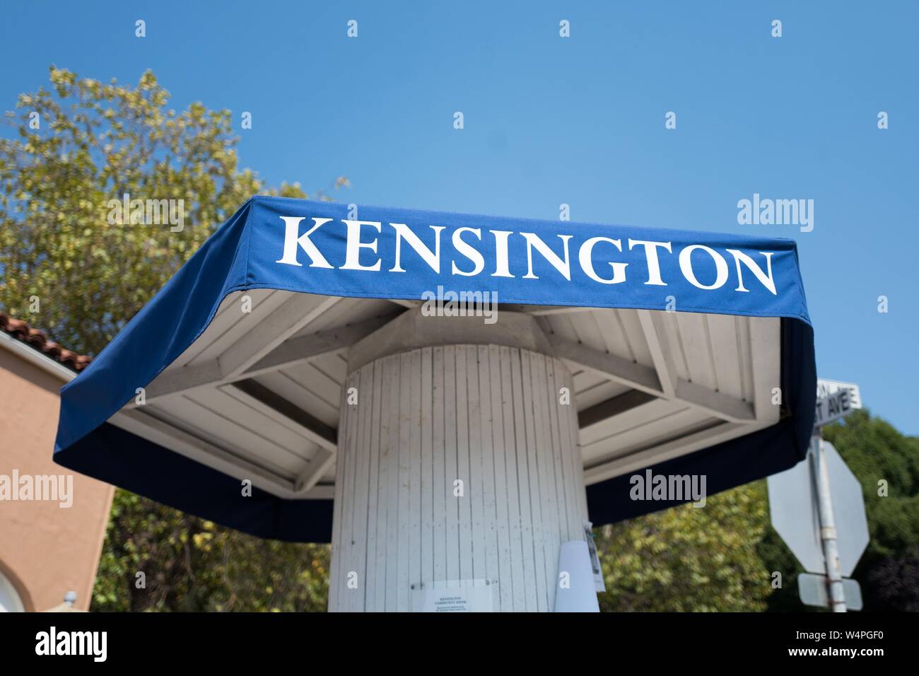 Town message board with shaded top reading Kensington in a public square in Kensington, California, a small town in the San Francisco Bay Area, September 4, 2018. () Stock Photo