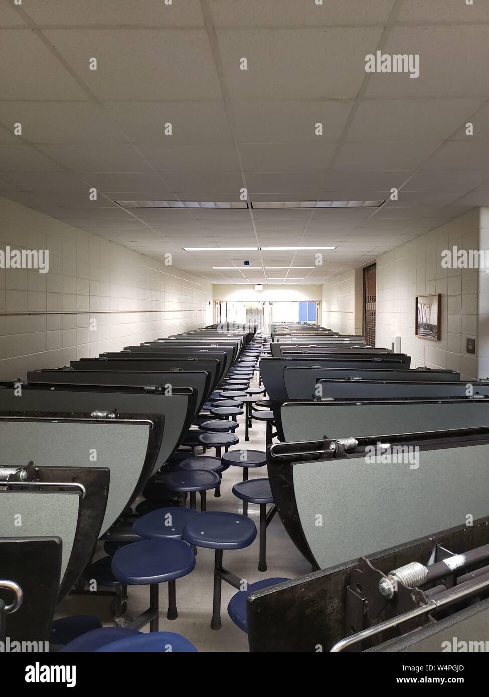 Folding cafeteria tables lined up and ready for the new school year. Stock Photo