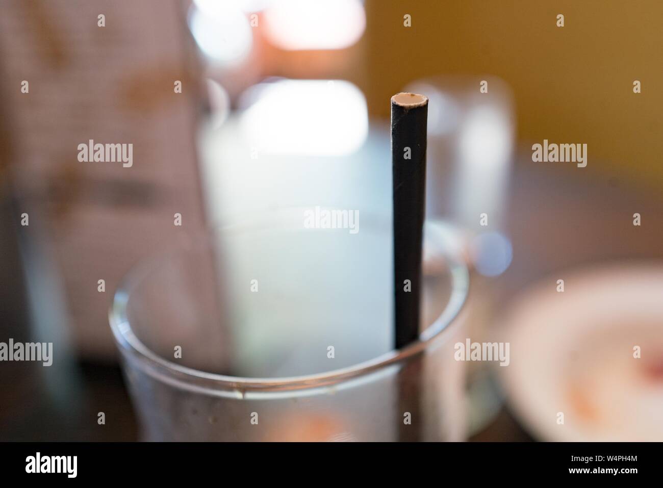 Close-up of a paper drinking straw in a beverage glass; many cities, including San Francisco, have enacted or considered bans on plastic drinking straws, with many restaurants using paper alternatives, Lafayette, California, September 10, 2018. () Stock Photo