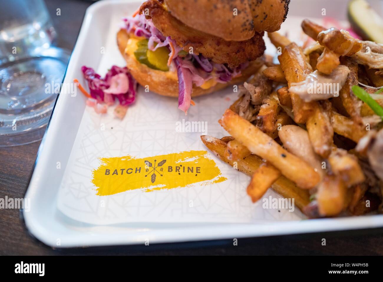 Close-up of logo for Batch and Brine upscale sandwich restaurant on a plate with a fried chicken sandwich, Lafayette, California, September 10, 2018. () Stock Photo