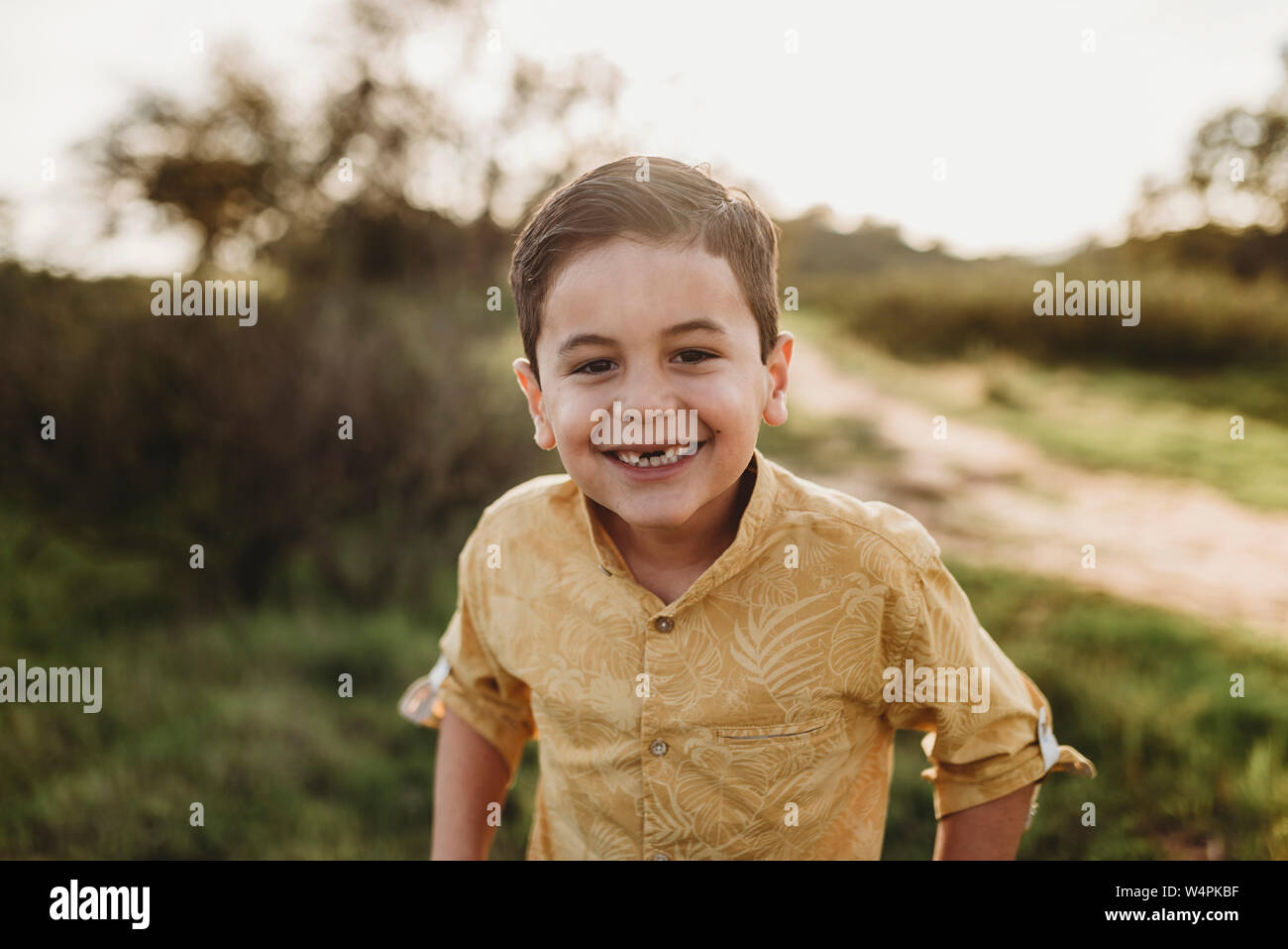 Portrait of young school-aged boy missing two front teeth Stock Photo
